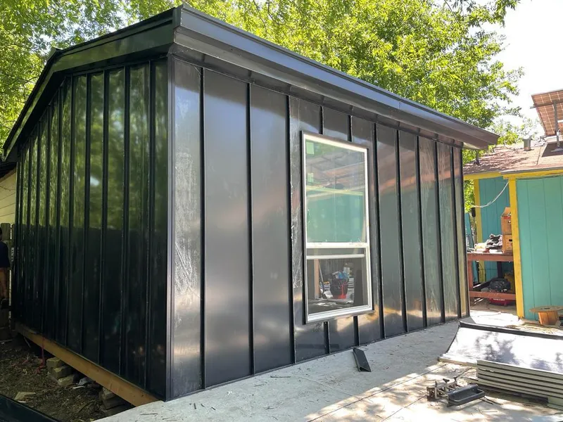 Black standing seam metal wall panels for Roof Inspection in Edna