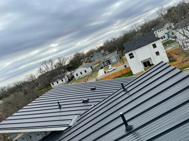 Standing seam metal roof panels with vents for Skylight Repair in Edna